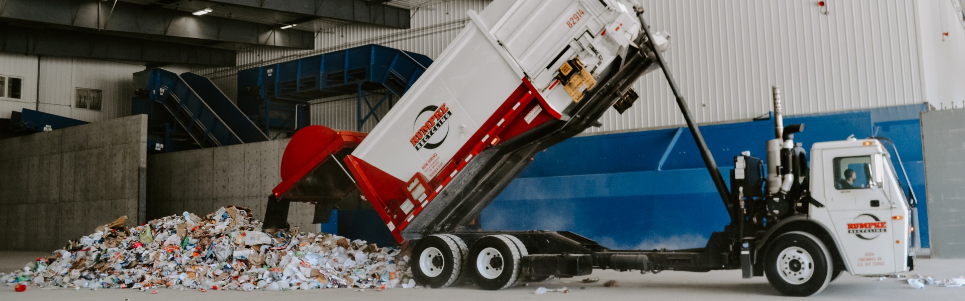 Rumpke Recycling Truck Dropping Off Recyclables At Recycling Facility