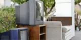 Bookshelf Couch And Two Televisions Outside For Rumpke Bulk Trash Removal