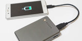 Smartphone Plugged Into Lithium Ion Battery