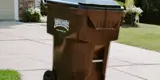Wheeled Trash Cart On Curb For Rumpke Bulk Trash Pickup