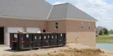 Rumpke Commercial Roll Off Dumpster On Construction Site