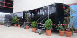 Two Black Rumpke Deluxe Restroom Trailers At A Special Event