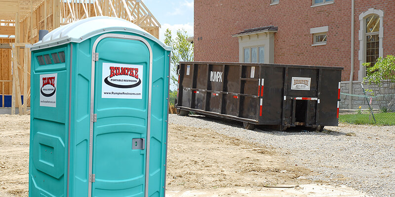 Rumpke Restroom And Dumpster On Construction Site
