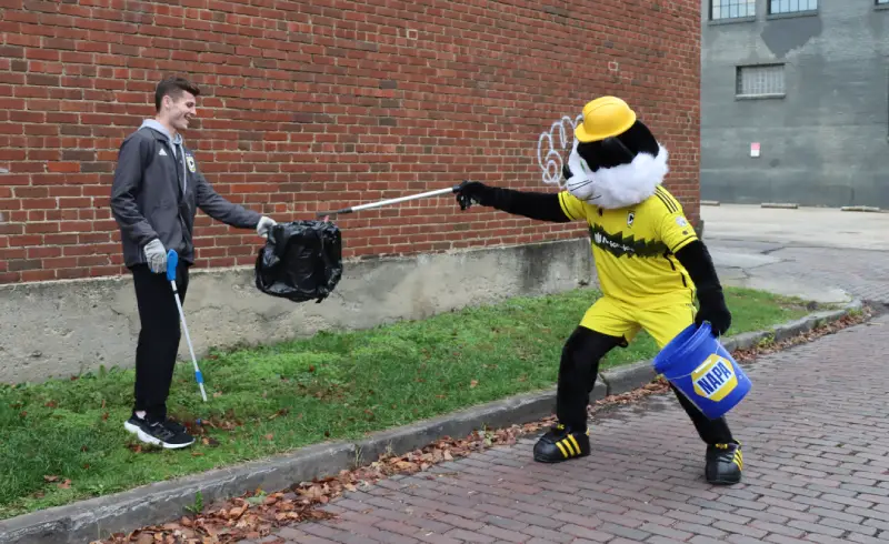 Two People Recycling In Columbus Ohio On America Recycles Day