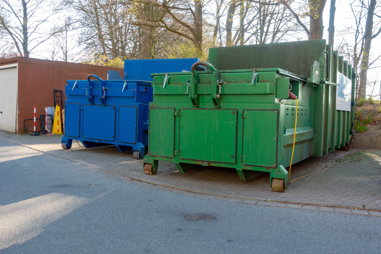 Blue And Green Compactors On Pad In Good Condition