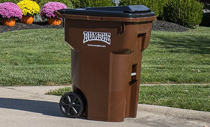 Rumpke Trash Cart Ready For Pickup On Residential Driveway
