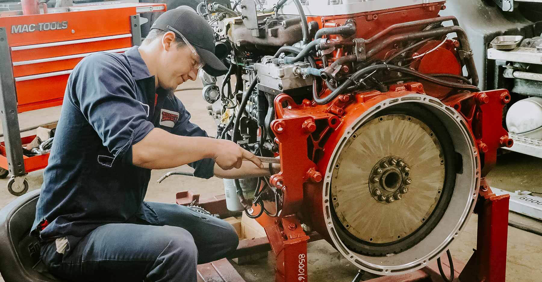 Rumpke Mechanic Using Wrench For Equipment Repair