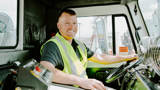 Rumpke Truck Driver Smiling In Driver Seat
