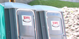 Two Green Wheelchair Accessible Porta Potties