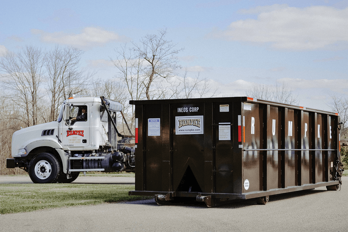 Rumpke Roll Off Dumpster In Front Of Rumpke Roll Off Truck