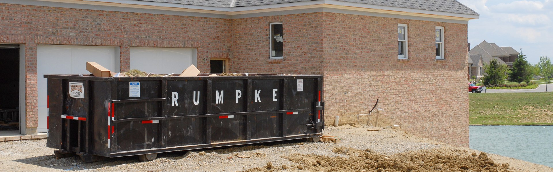 Rumpke Commercial Dumpster On Construction Site